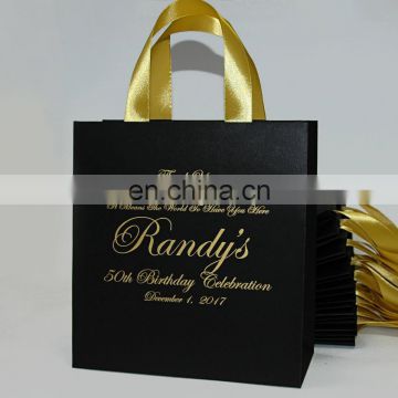 Elegant black and gold birthday party gift paper bags with satin ribbon handles