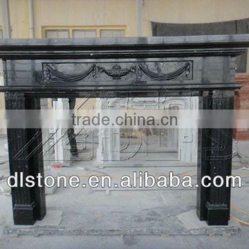 Black granite and marble fireplace surround