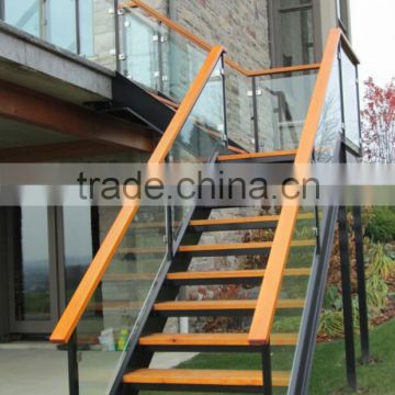 Iron stair with ceder treads and handrail and glass railing