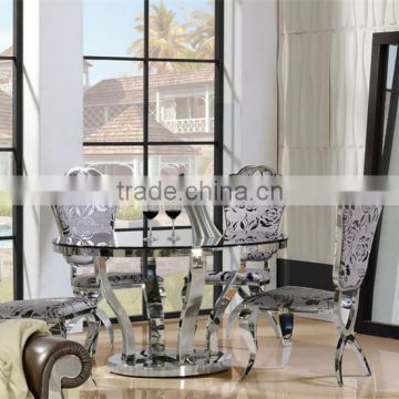 Promotion factory price stainless steel restaurant table with glass top/round dining table with chairs