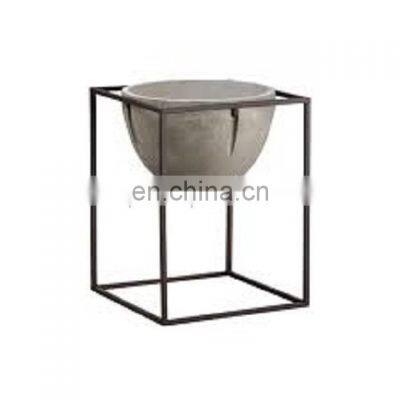 white round planter with metal stand