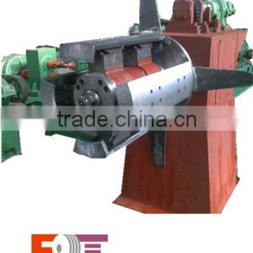 coil rewinding machine with hold down arms