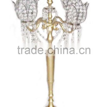 Gold candelabra with crystal flower