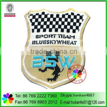 Woven patch with adhesive back
