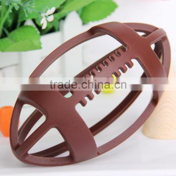 Hollow-out baby silicena teether rugby shape