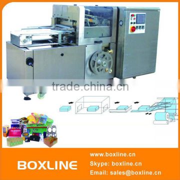 Automatic over wrapping machine