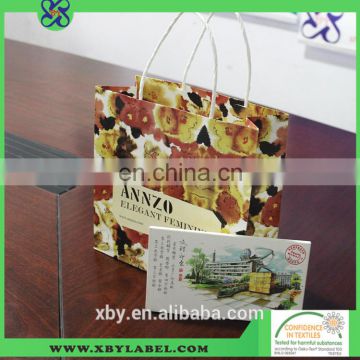 White packing paper bag with satin and pp rope handles