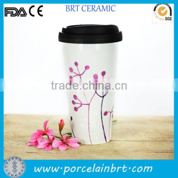 white ceramic travel mug with silicon lid