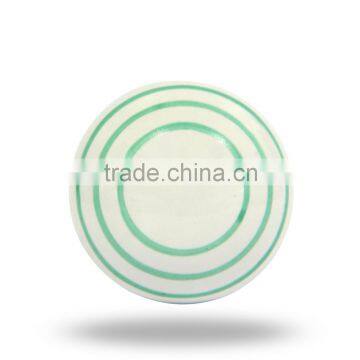 ceramic white knob with green circles