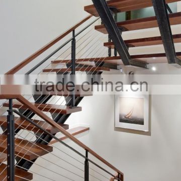indoor stair with wood tread and railing