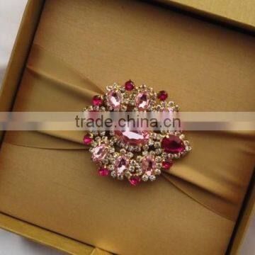 Silk box with large embellishment.