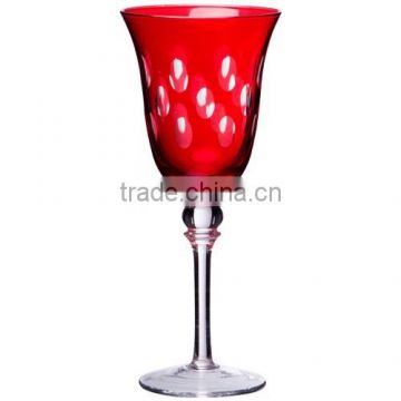 Red wine glass with red spraying and hand cutting dots.