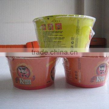 bowl packing fast noodles with sachet and folk inside