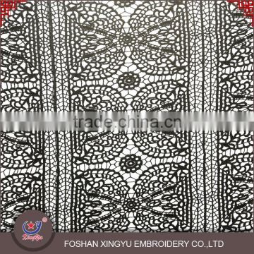 Hot sale promotional cheap chemical net embroidery design lace fabric for vest