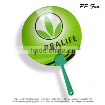 Paper fan with green handle