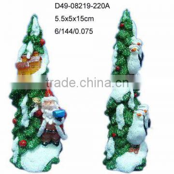Christmas tree candle with santa and penguin