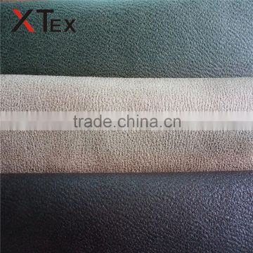 hot sale 100% polyester bronzed embossed faux suede leather look like fabrics for sofas,cushions,chairs