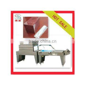 Semi automatic heat tunnel shrink wrapping / packing machine