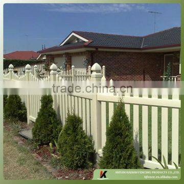 Wide white picket garden fence