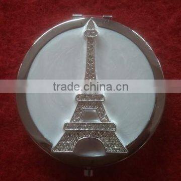 round compact mirror with decorative Eiffel Tower decor
