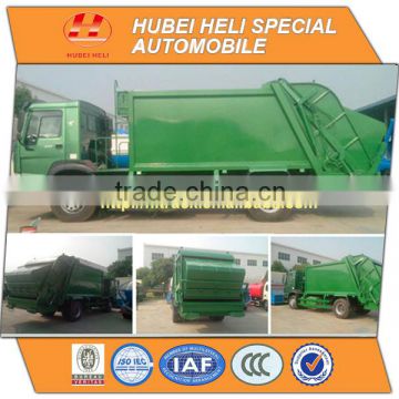 SINOTRUK HOWO 4x2 12cbm refuse compactor WD615.92 266hp with pressing mechanism