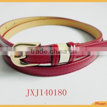 narrow belt with fancy buckle and golden end