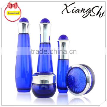 cosmetics cream glass bottles and jars blue