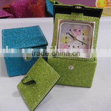 Travel alarm clock with shining color leather cosmetic pocket