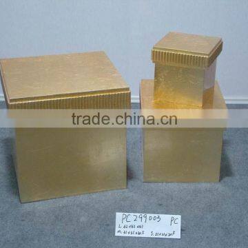 There are three simple wooden golden box