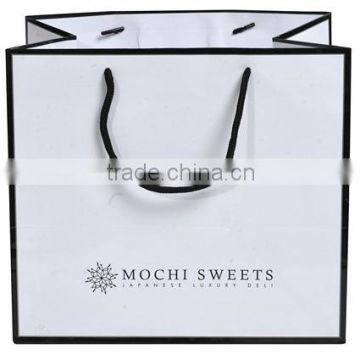Brightly Red Gift paper bag With pp rope handles and hangtag