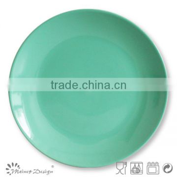 green colorful stoneware round salad plate