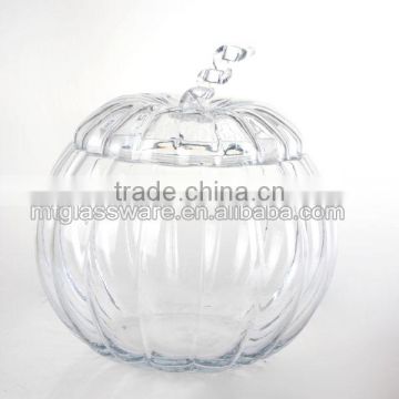 The shape of a pumpkin glass dispenser with metal stand