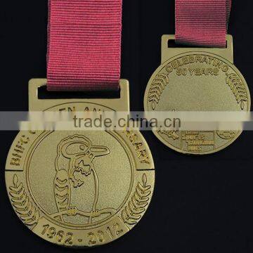 2.17" size, golden plated, with red ribbon, 50 years celebrating football medals and trophies