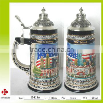 Embossed and handpainted ceramic beer stein with pewter lid