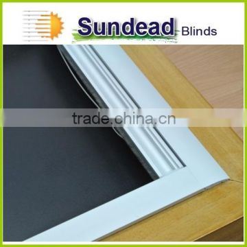 Skylight blinds with blackout fabric C2 with silver coating at background, compatible with roof window frame