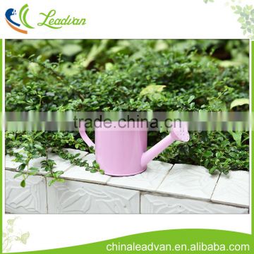 Pink decorative small metal watering can for kids