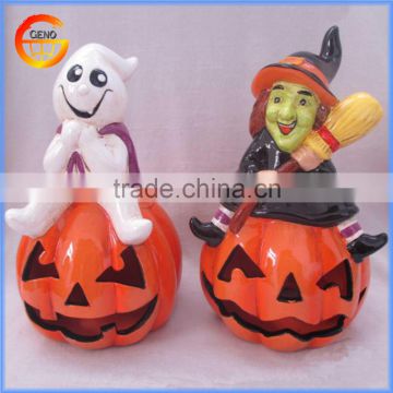 Ceramic pumpkins with halloween witch figurines