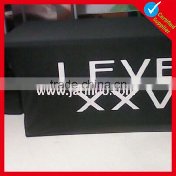 black elastic tablecloth with white design