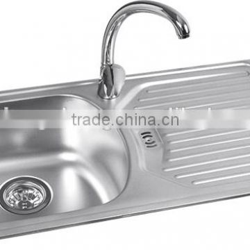 Stainless steel water trough wash bowl of the sink in the kitchen