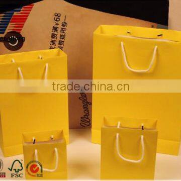 Various size popular yellow color paper bag with lamination and handles for sale