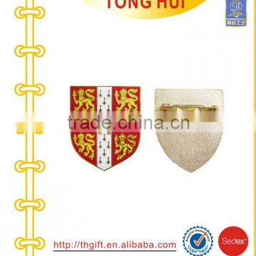Soft enamel badges with gold color and safety pin on back side