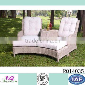 Rattan Loveseat and Footrest With Cushion