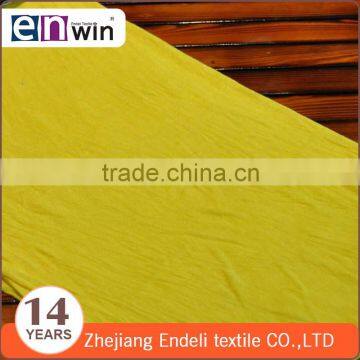 shaoxing knit fabric factory supply light weight single jersey yellow fancy fabric for sports wear