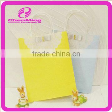 Yiwu wholesale yellow paper gift bags without handles