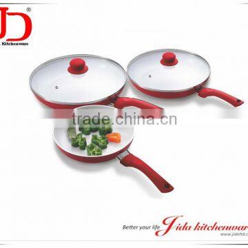 Induction bottom non stick frying pan with lid, white ceramic coating.