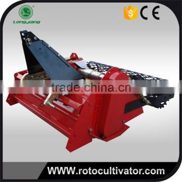 Tractor implement stone burier