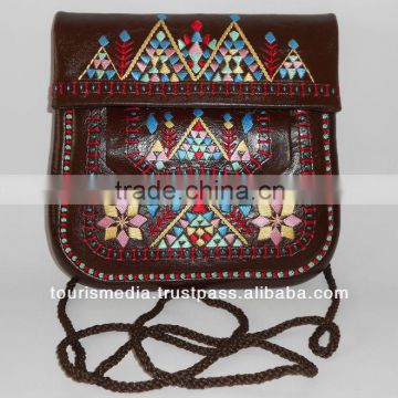 handstitched moroccan brown leather clutch with shoulder strap