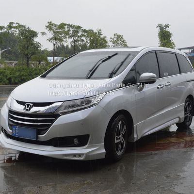 The Honda Odyssey car is surrounded by a 14-15 odyssey front and rear spoiler skirt, and the odyssey bumper chin lip