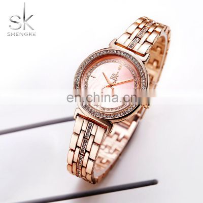 SHENGKE Rosegold Female Wristwatchs Pretty Pink Dial Quartz Watches Alloy with Diamond Inlaid Bezel Band Bracelet Watch