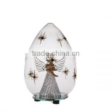 clear glass angel ornament in christmas tree decoration